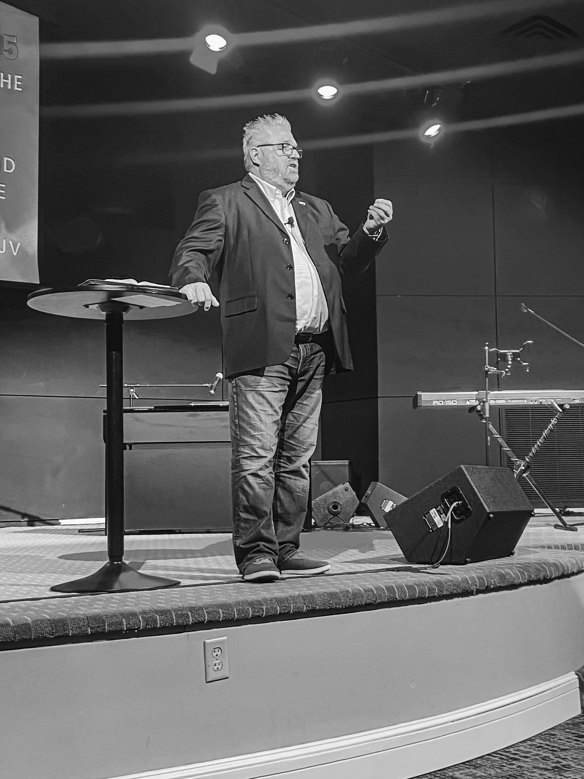 Pastor Mike Campbell preaching from the platform